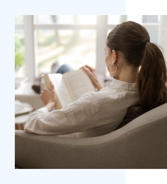 h2 7 Woman reading quietly by a sunlit window—symbolizing reflection and gentle healing.